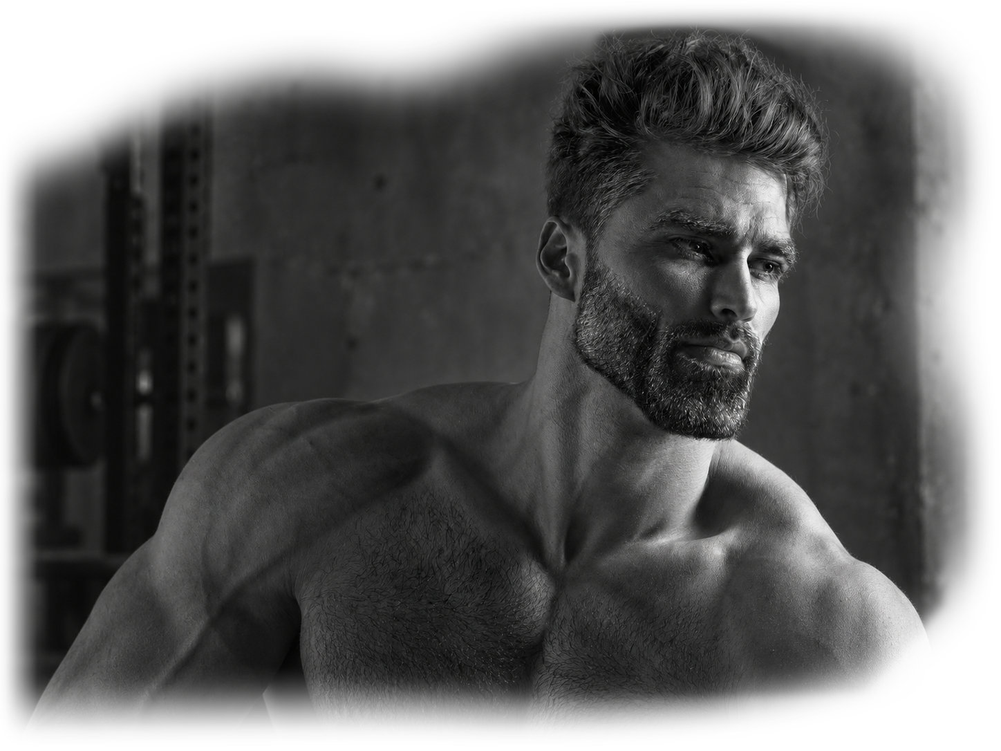 Black and white portrait in a gym with weights and a concrete wall